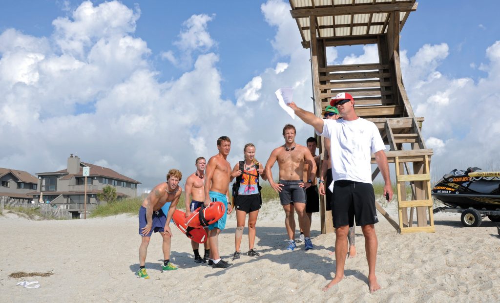 Wrightsville Beach Ocean Rescue captain Jeremy Owens directs a team on its next task during the grueling Lifeguard Challenge in May 2012. WBM file photo.