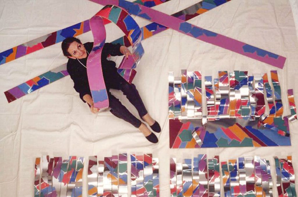 Artist Dorothy Gillespie works on a site-specific installation in the 1990s. Photo courtesy Gary Israel