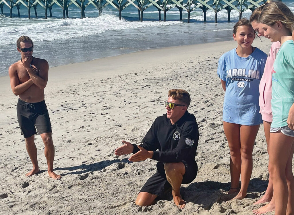 Brendan Huston teaches a portion of the Jeremy Owens Junior Lifeguard Camp in June. Huston is a current member of Wrightsville Beach Ocean Rescue who participated in the junior camp in 2016. Courtesy of Wrightsville Beach Ocean Rescue

