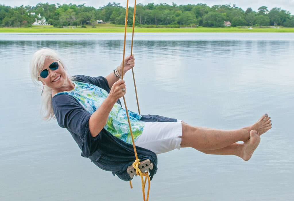 Pat Bradford has long enjoyed rope swings. For it to be out over clear, pretty water on a hot summer day, what could be better? Pat’s hair by Frank Potter, styled by Emily Wade, makeup styled by Regan Daughtry, all of Bangz Hair Salon. Photo by Allison Potter