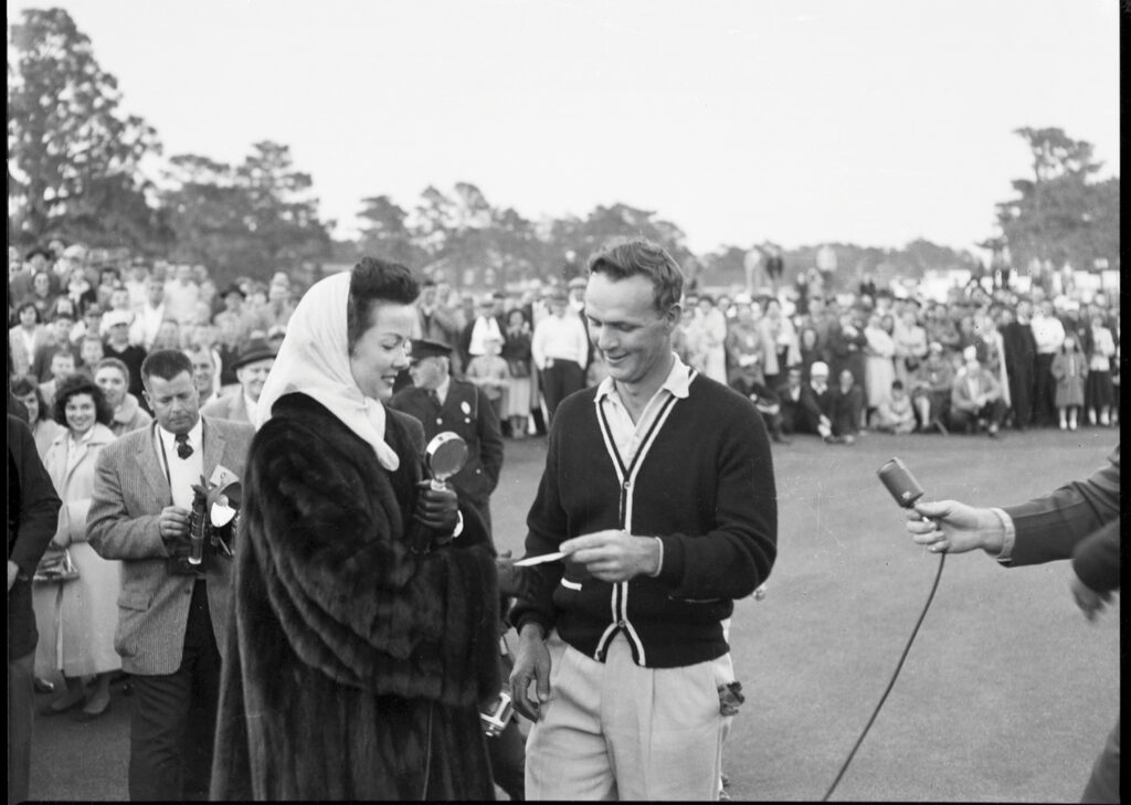 Arnold Palmer accepts the winning
check from Azalea Queen Kathryn Grayson in 1957. Photo From Hugh Morton Photograph And Films/Wilson Special Collections Library/UNC-Chapel Hill