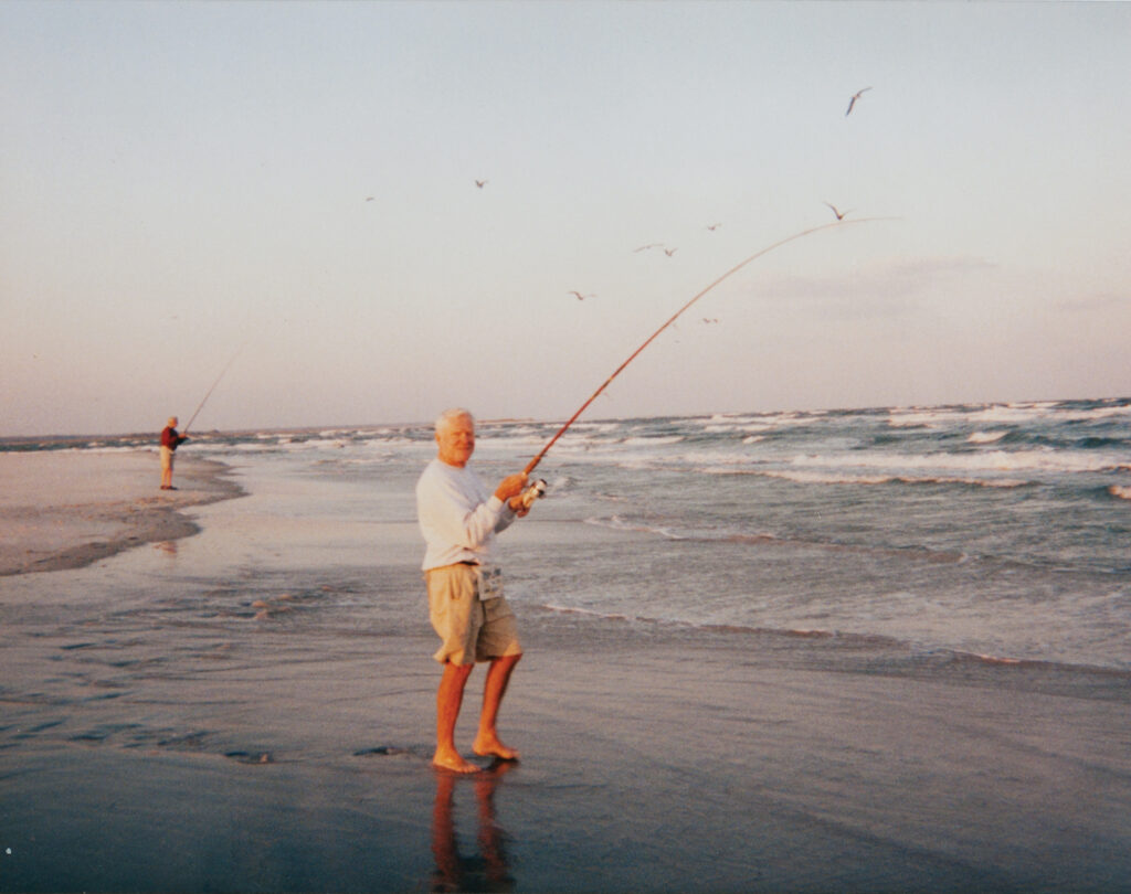 George Clark surf
fishes on Figure Eight Island in 1999. Photo courtesy of George Clark Jr.
