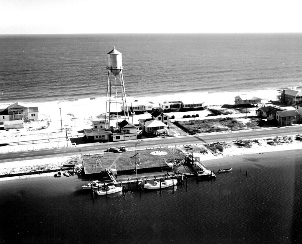 Beginning in 1958 the government maintained a Light Attendant Station on Wrightsville Beach, located across from the old
Town Hall. This photo was taken in 1961. The odd-looking boat in the foreground is a 36-foot beach rescue vessel, a self-righting, selfbailing
motor life boat, which was in common use until the late 1970s. Coast Guard historians in Washington said the Light Attendant’s job
was to maintain the minor aids to navigation, the buoys and acetylene buoys. Photos Courtesy of US Coast Guard Archives, Washington D.C.
