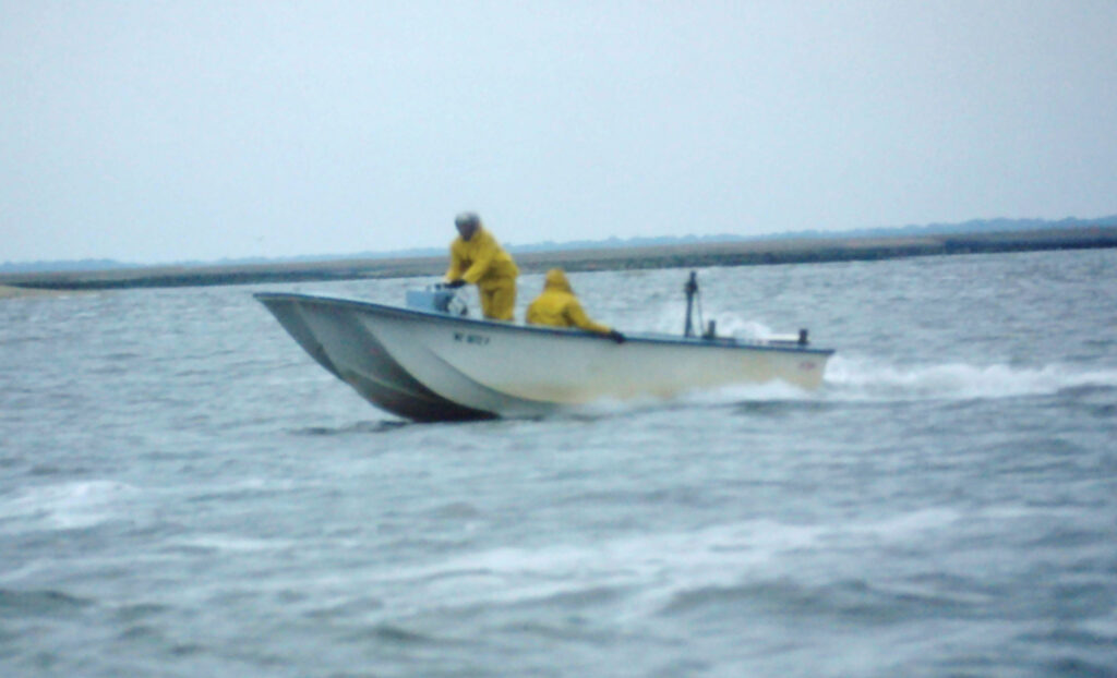Biologists sampling the Cape Fear River from a UNC triple-hull skiff. Ron Clayton