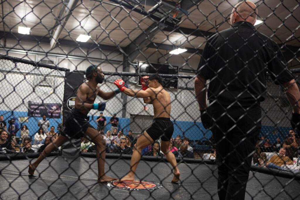 Fight scene from the April 2023 Ultimate Battle Grounds MMA event, Wilmington. Steve McMillan