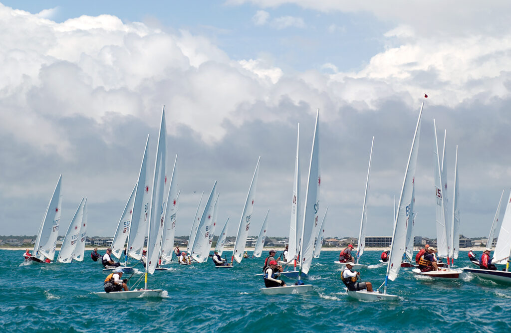 Sailors compete in the Laser Masters North American regatta off the shore of Wrightsville Beach. WBM File Photo