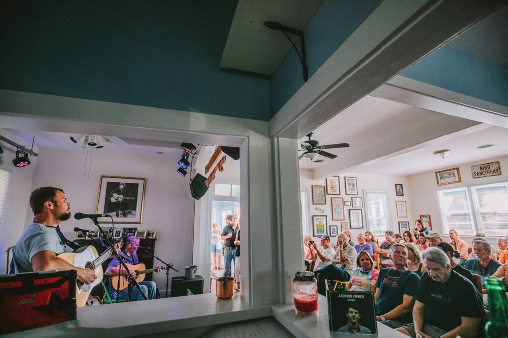 The band L Shape Lot performs Sept. 8, 2019. Alex Lanier in the light blue shirt standing, Eric Miller in the dark blue shirt sitting, both on guitar and vocalists. The Vibrant, Michael Escobar