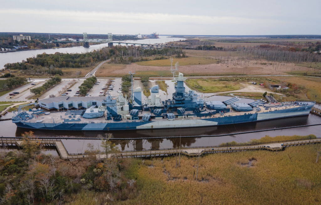 The Battleship North Carolina’s low-lying location on the Cape Fear River means the grounds are prone to flooding. Steve McMillan